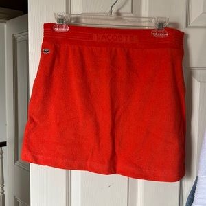 Lacoste orange skirt size 38. Never been worn.